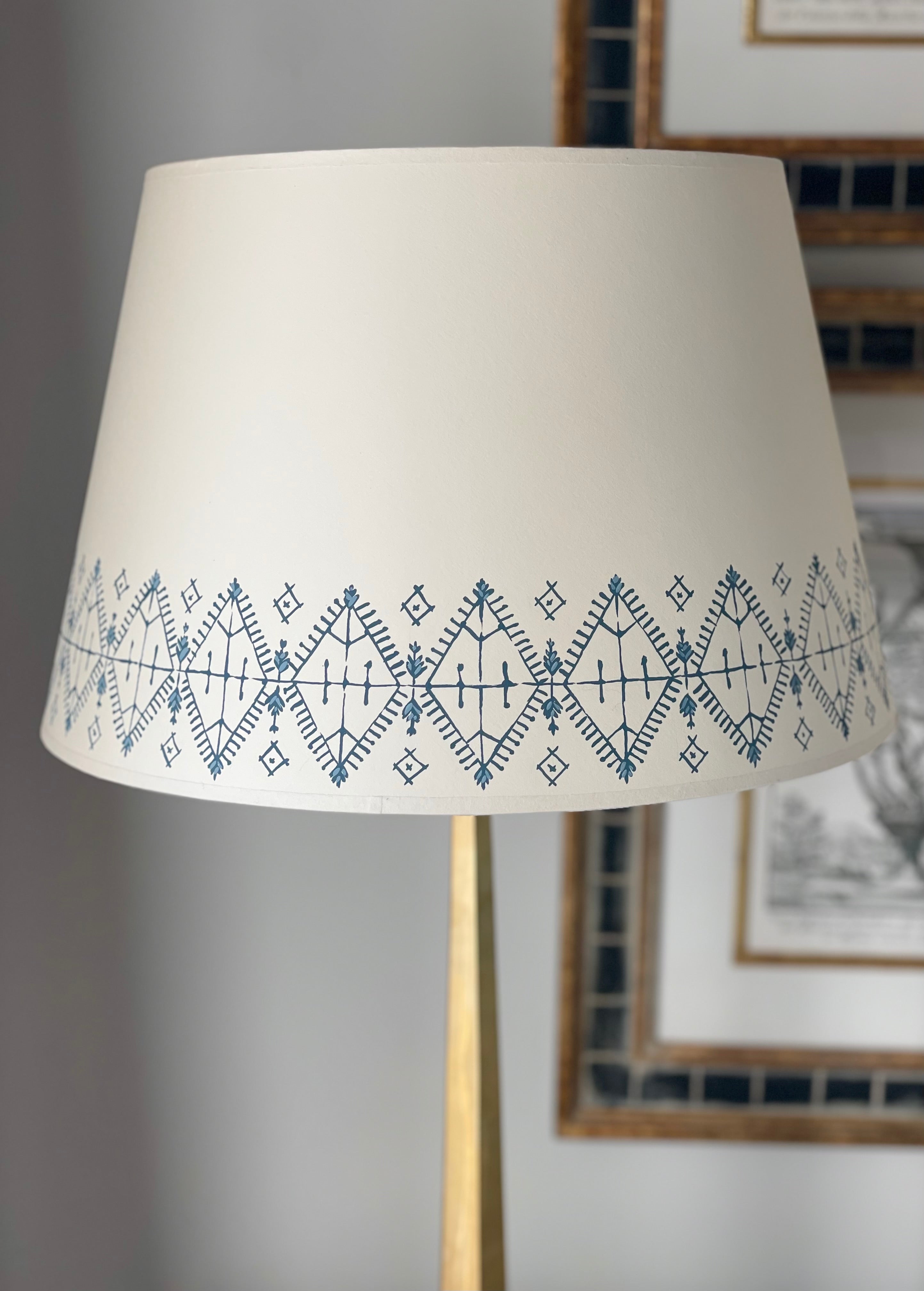 cream card lampshade with a Moroccan border in blue