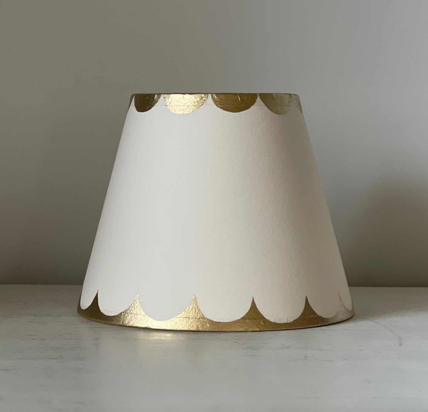 cream card lampshade with gold scallops