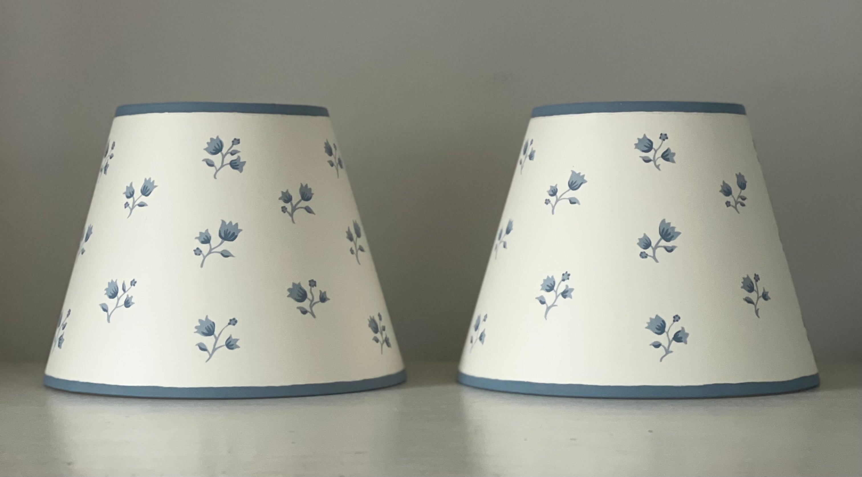 handpainted lampshades with blue sprigs on pale cream card