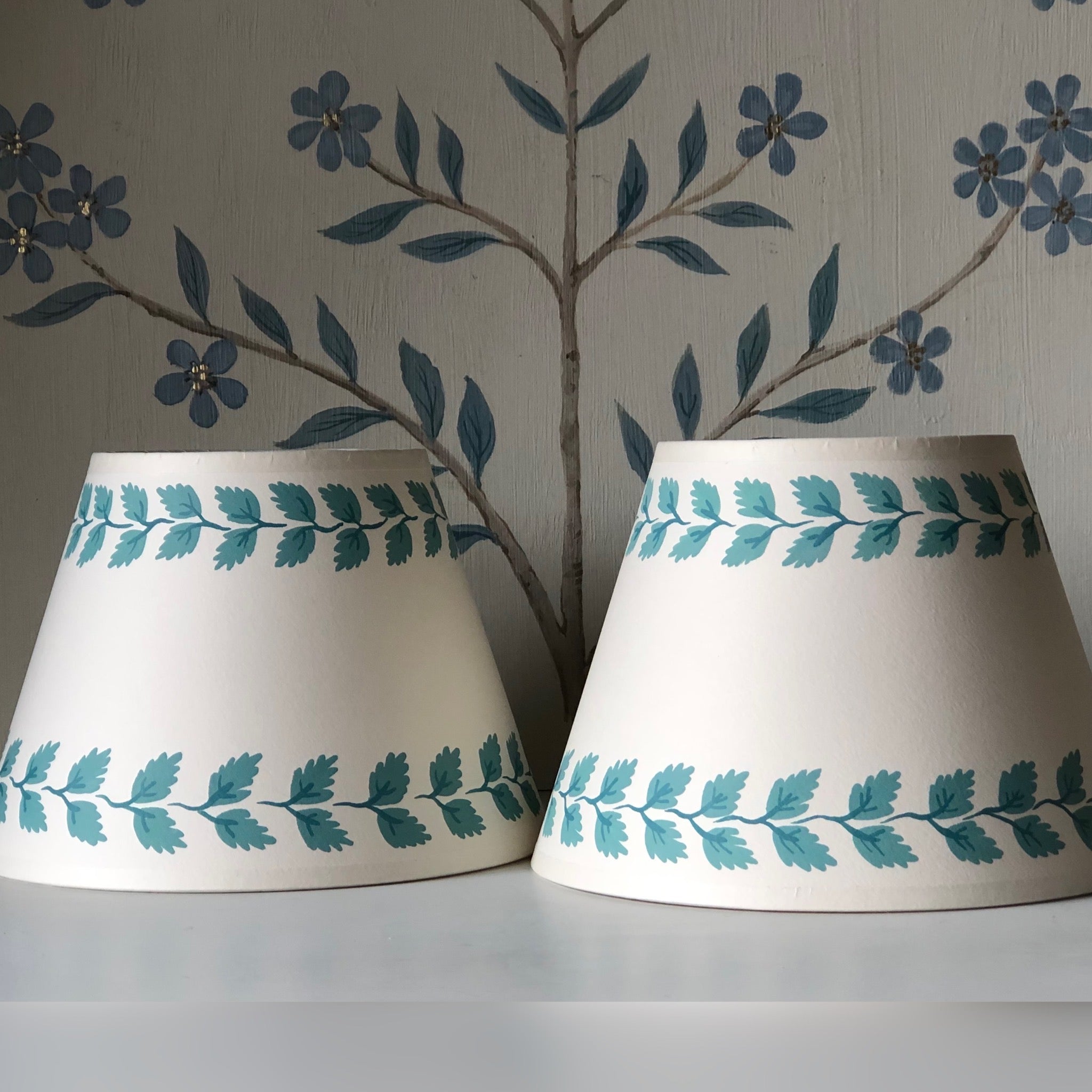 pale cream card handpainted lampshades with a leafy garland